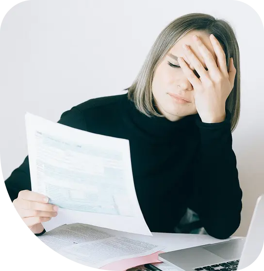 Parent looking stressed about NDIS paperwork. Go Inclusion helps families navigate NDIS and advocate for their child confidently.
